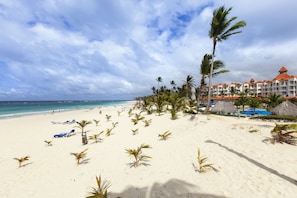 On the beach, white sand, beach towels, beach massages
