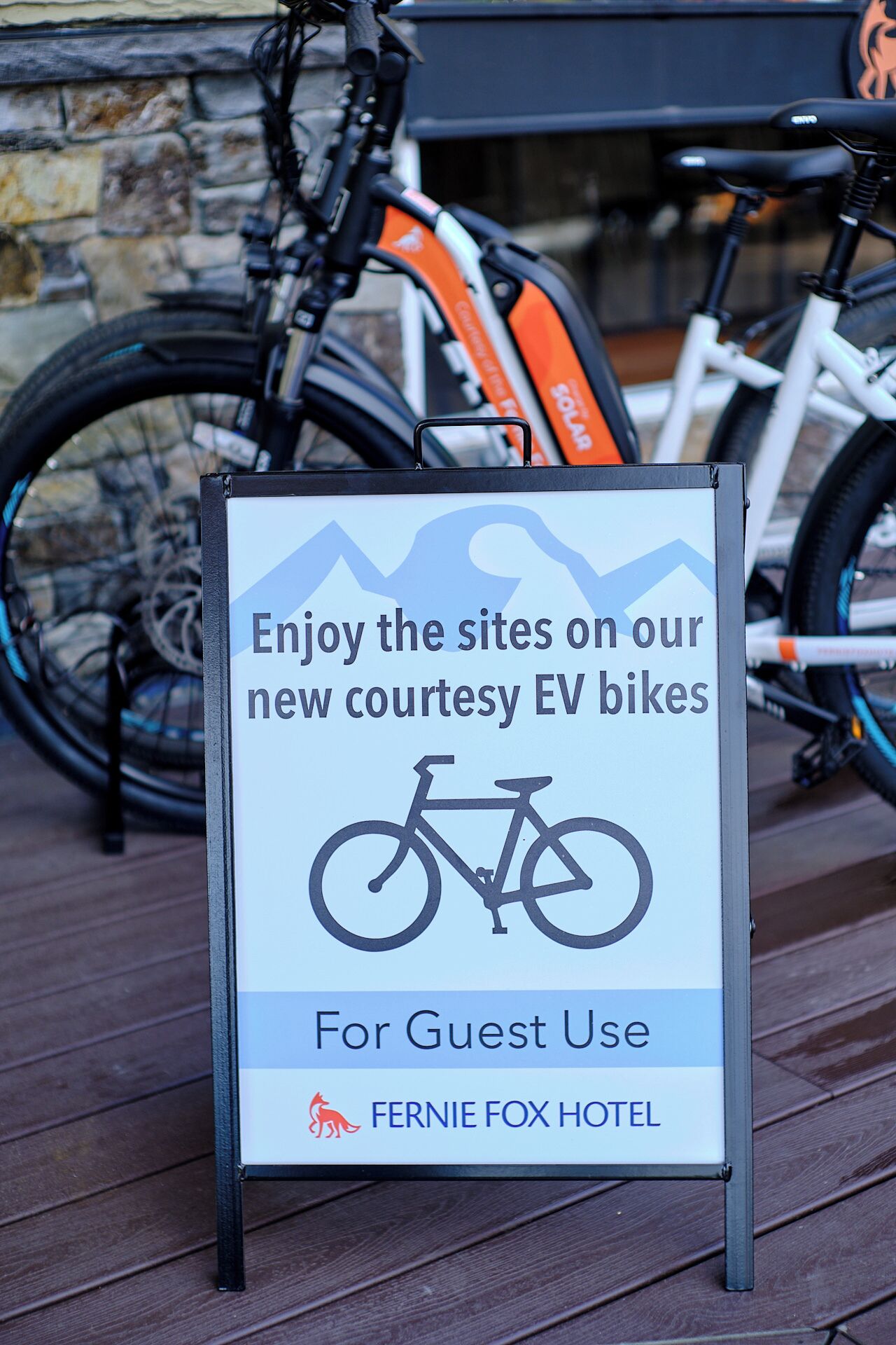 A sign for guest use at the Fernie Fox Hotel advertising new courtesy EV bikes.