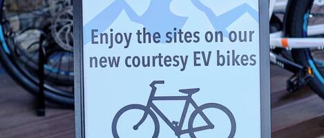 A sign for guest use at the Fernie Fox Hotel advertising new courtesy EV bikes.