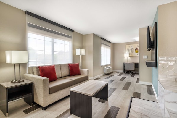 Suite, 1 King Bed, Non Smoking, Jetted Tub (with Sofabed) | Desk, laptop workspace, blackout curtains, iron/ironing board