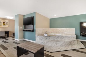 Suite, 1 King Bed, Non Smoking, Jetted Tub (with Sofabed) | Desk, laptop workspace, blackout drapes, iron/ironing board