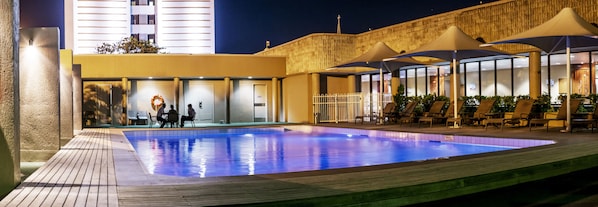 Outdoor pool, open 6:00 AM to 7:00 PM, pool loungers