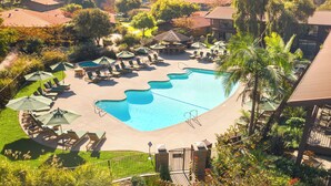 A resort with a large swimming pool, lounge chairs, and a view of mountains. - The Ranch at Laguna Beach (Laguna Beach)