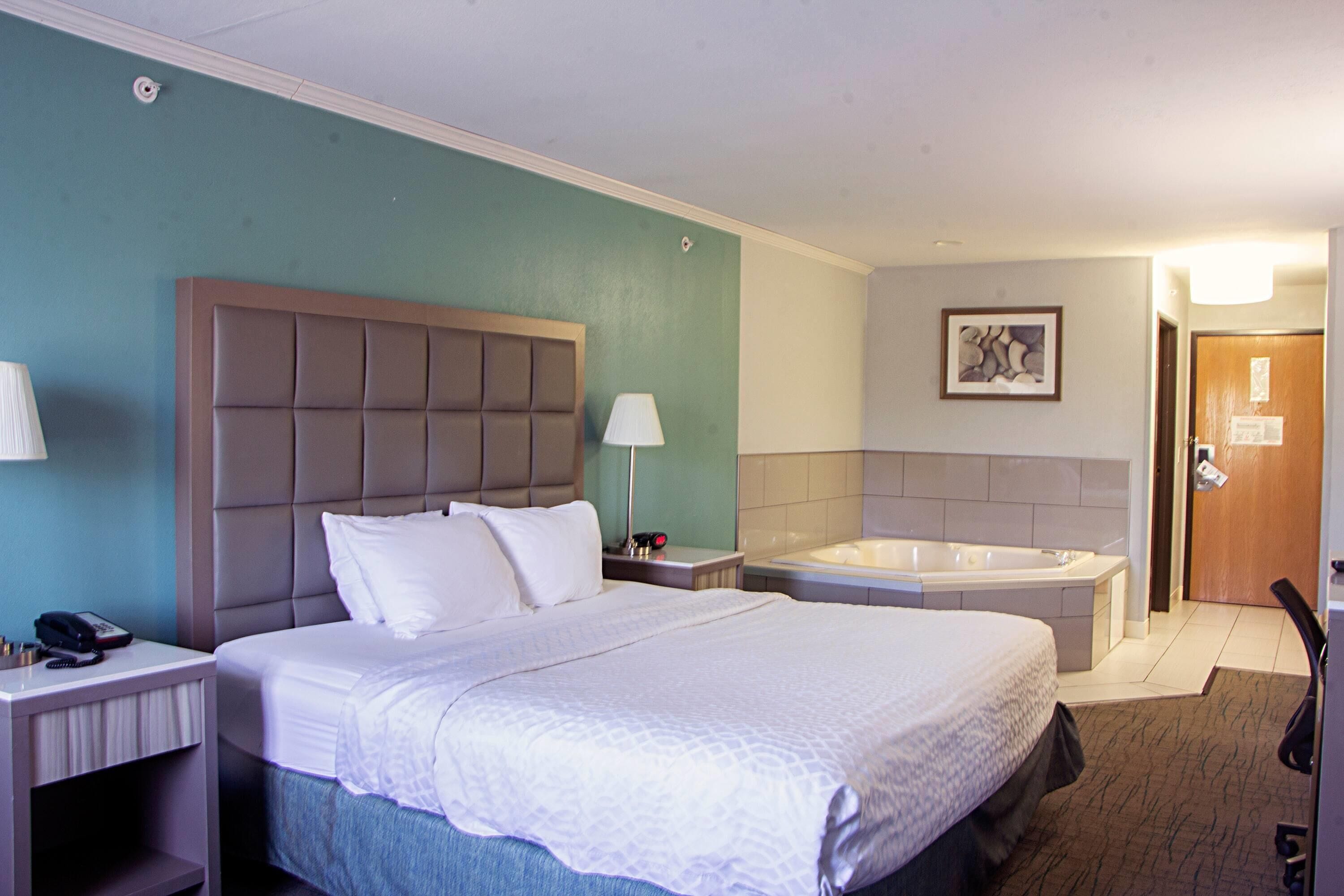 Suite, 1 King Bed, Non Smoking, Jetted Tub | Desk, laptop workspace, iron/ironing board, free cribs/infant beds