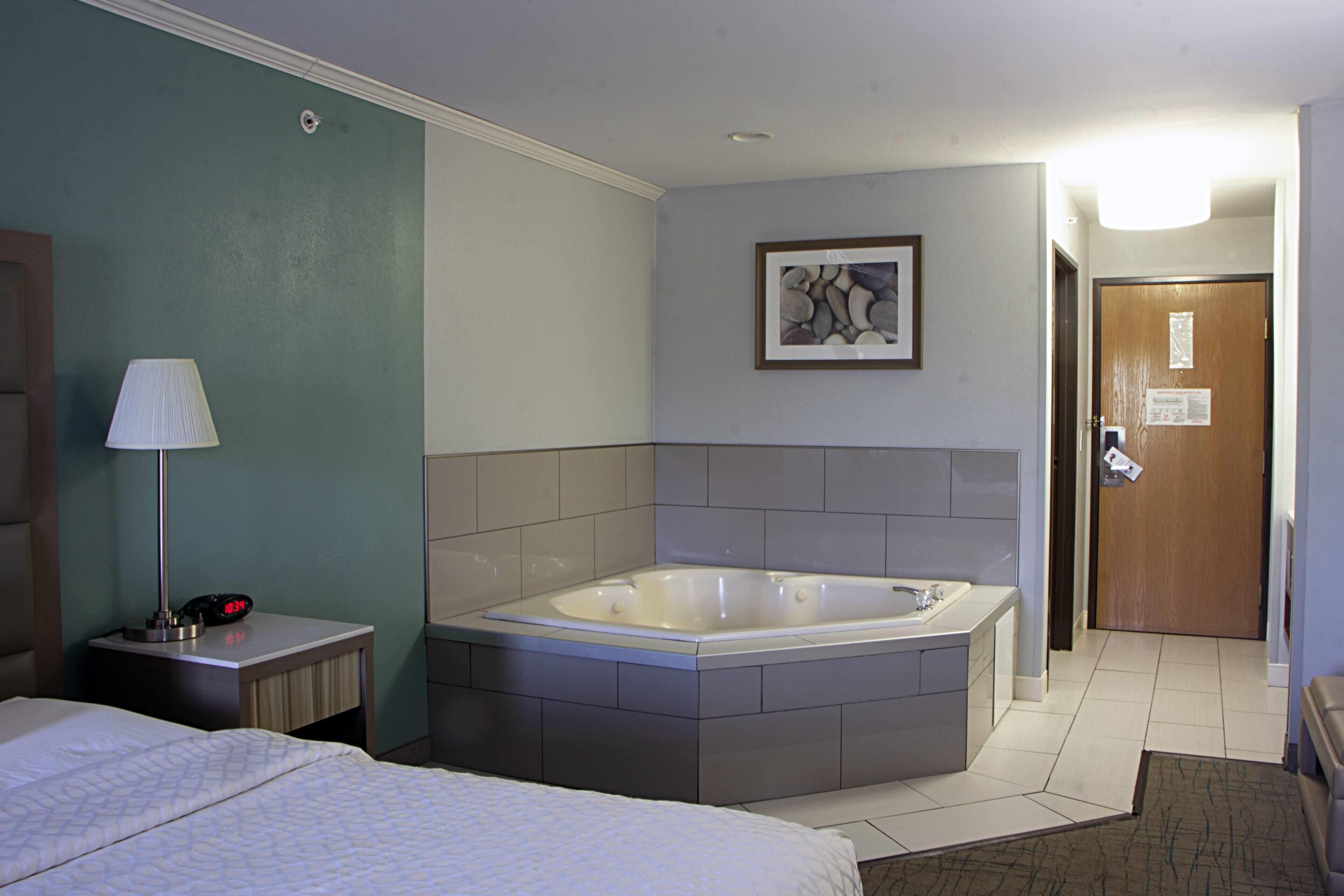 Suite, 1 King Bed, Non Smoking, Jetted Tub | Desk, laptop workspace, iron/ironing board, free cribs/infant beds