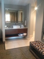 Desk, laptop workspace, iron/ironing board, free cribs/infant beds