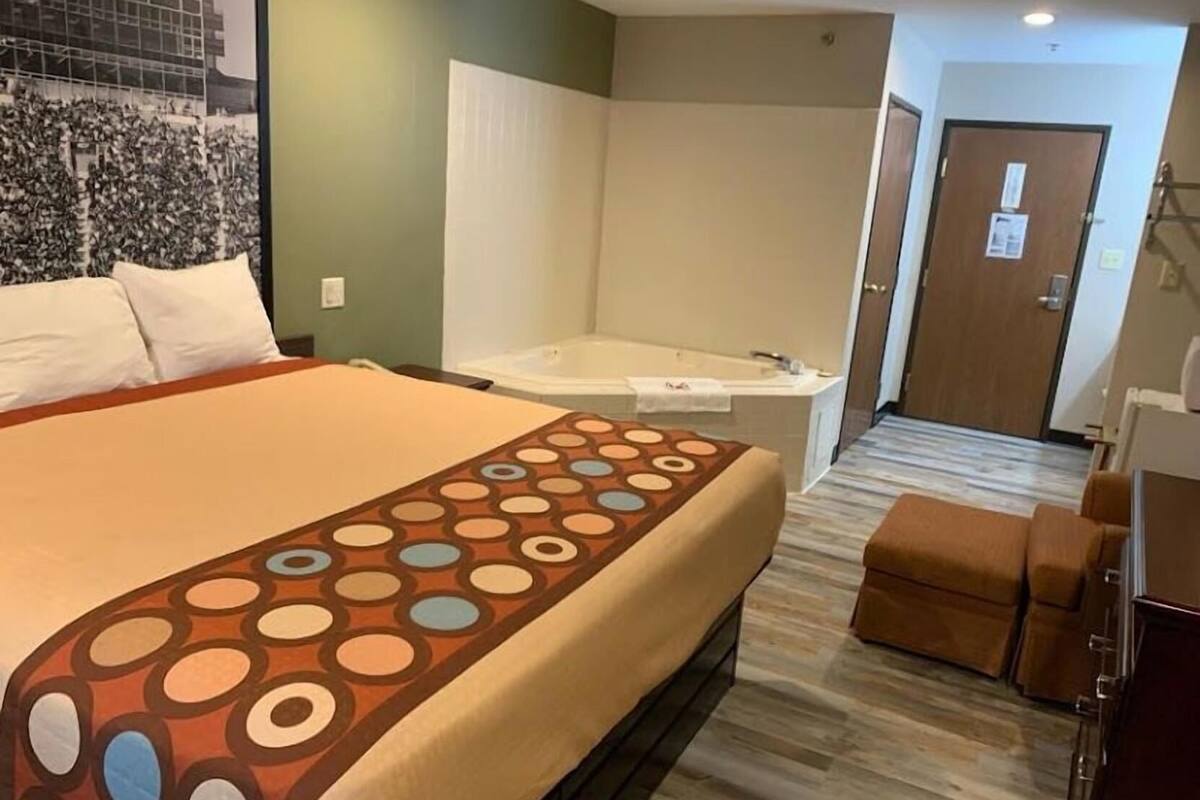 Desk, laptop workspace, blackout drapes, iron/ironing board