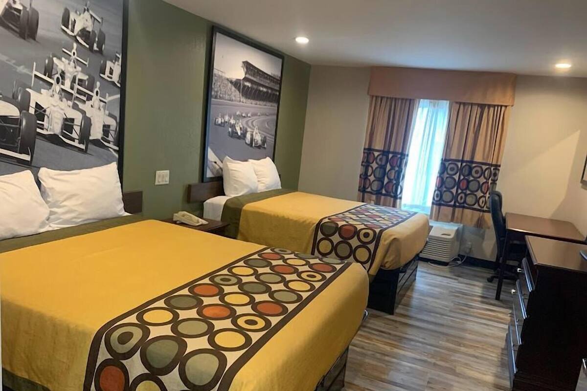 Desk, laptop workspace, blackout drapes, iron/ironing board