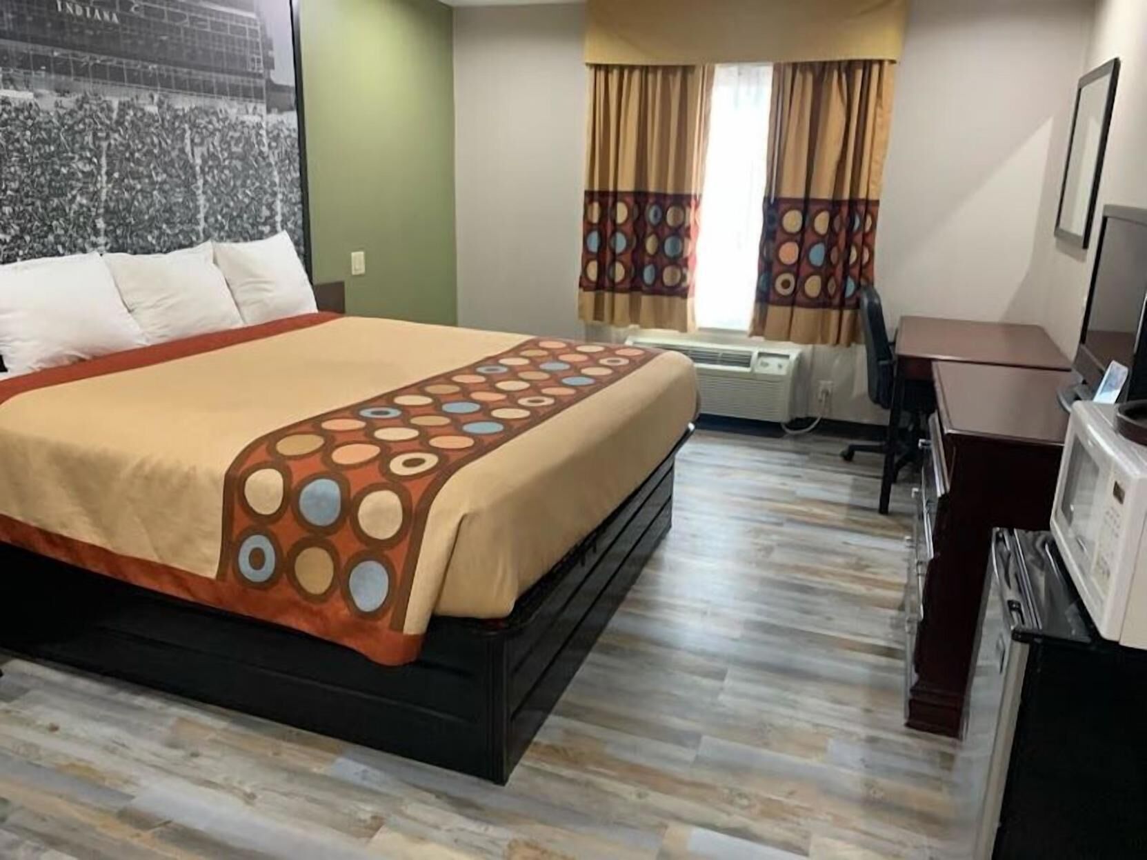 Desk, laptop workspace, blackout drapes, iron/ironing board