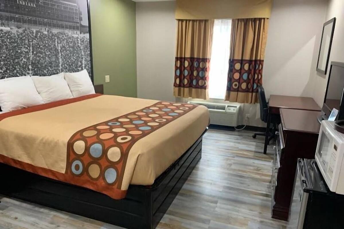 Desk, laptop workspace, blackout drapes, iron/ironing board