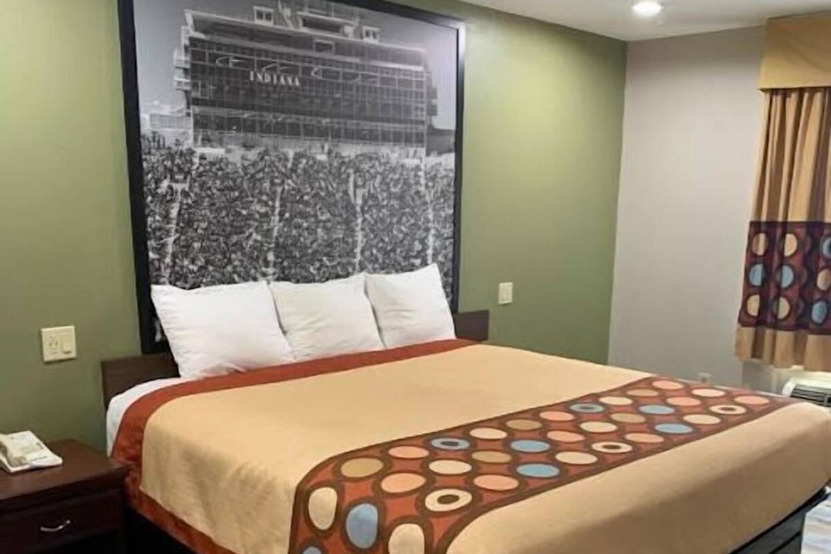 Desk, laptop workspace, blackout drapes, iron/ironing board