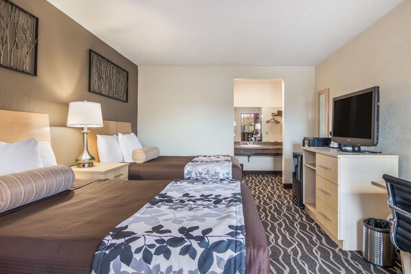 Desk, blackout drapes, iron/ironing board, rollaway beds