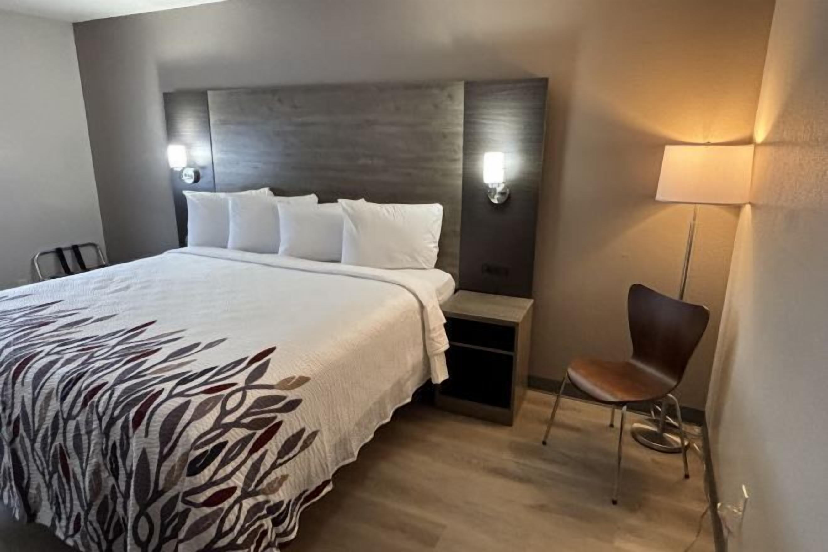 Desk, laptop workspace, blackout curtains, iron/ironing board