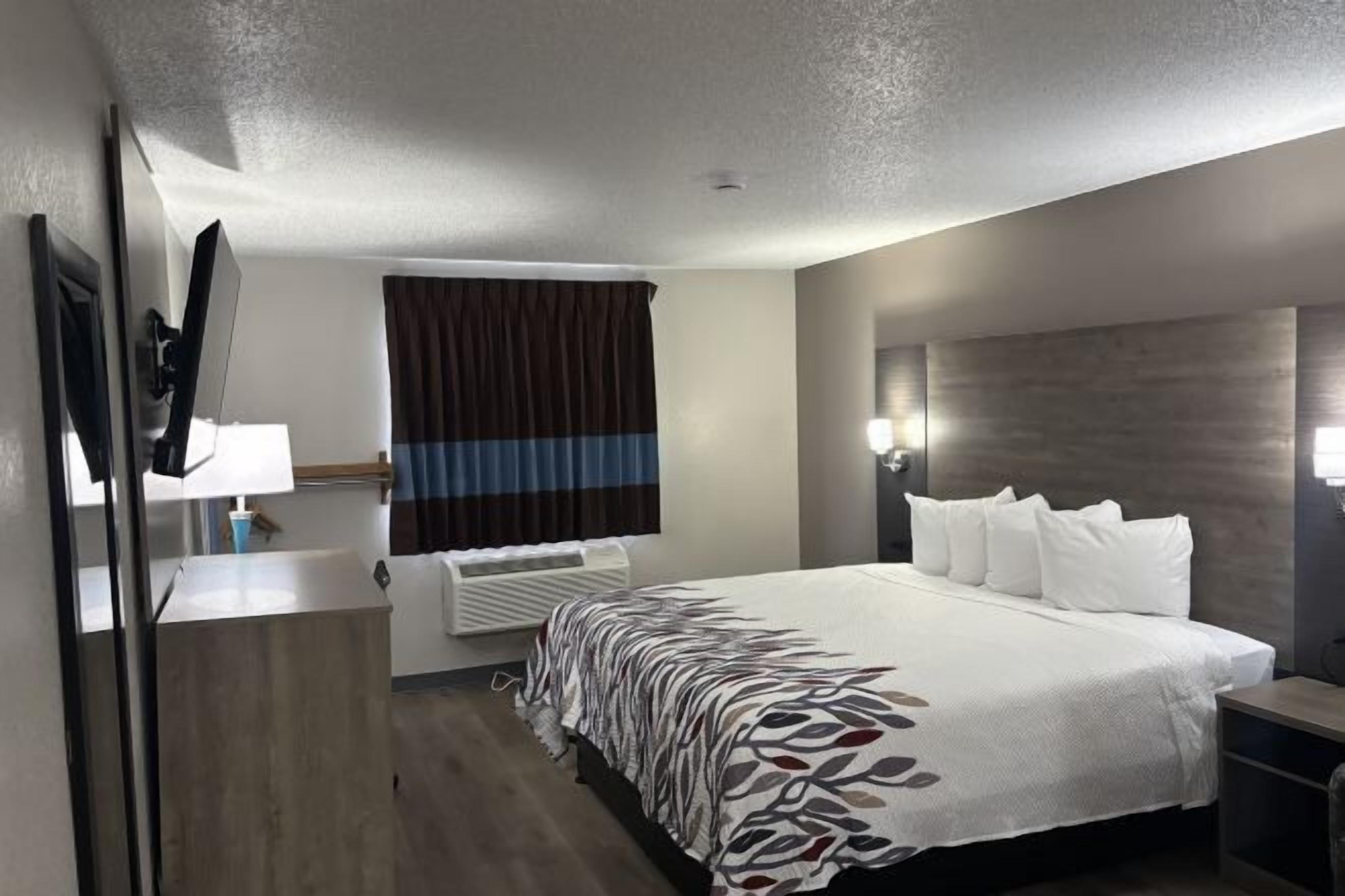 Desk, laptop workspace, blackout curtains, iron/ironing board