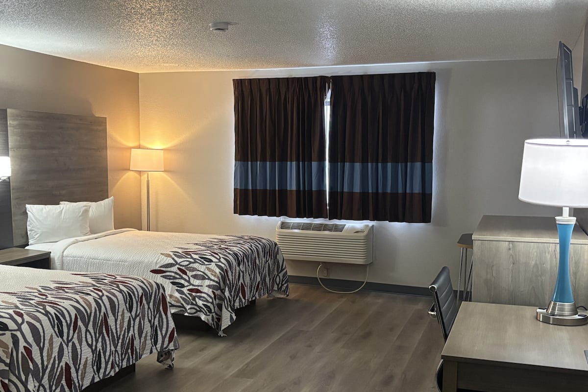 Desk, laptop workspace, blackout curtains, iron/ironing board