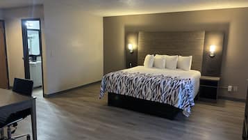 Suite, 1 King Bed, Non Smoking | Desk, laptop workspace, blackout curtains, iron/ironing board