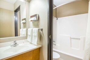 Separate bathtub and shower, towels