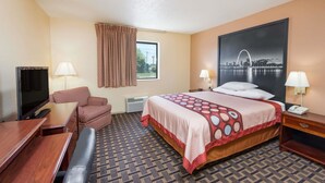 A hotel room with a bed, two bedside tables, a desk, a chair, a TV, and a window with curtains. - Super 8 by Wyndham Lebanon (Lebanon)