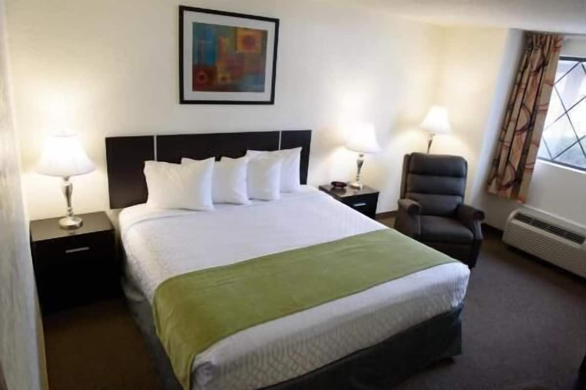 Pillowtop beds, desk, blackout drapes, iron/ironing board