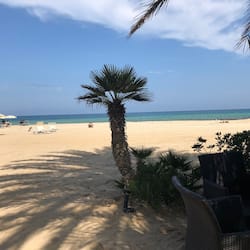 Private beach, white sand, sun loungers, beach umbrellas