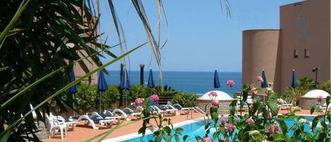 Seasonal outdoor pool, pool umbrellas, sun loungers