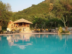 Outdoor pool, pool umbrellas, sun loungers