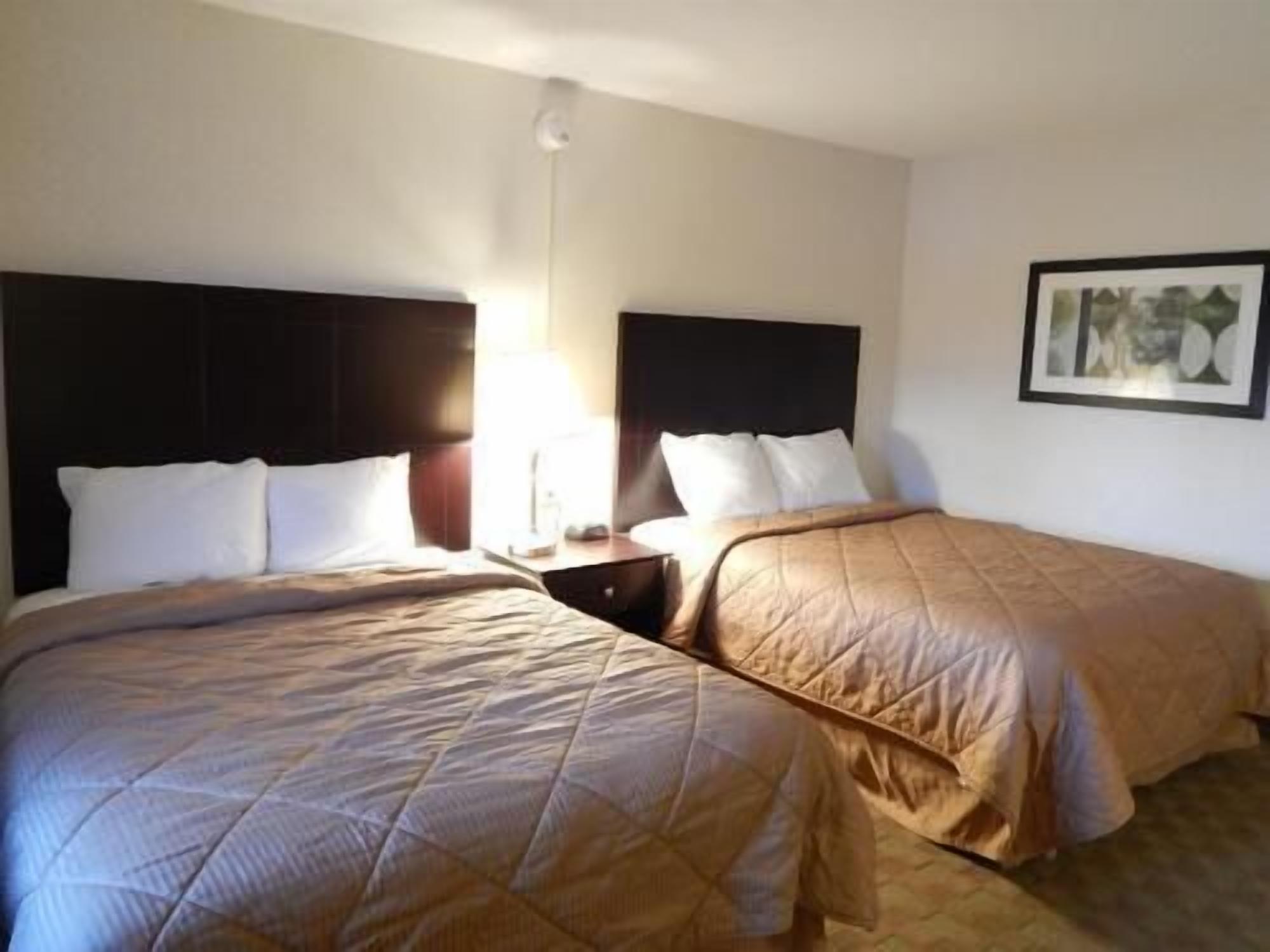 Desk, blackout drapes, iron/ironing board, free cribs/infant beds
