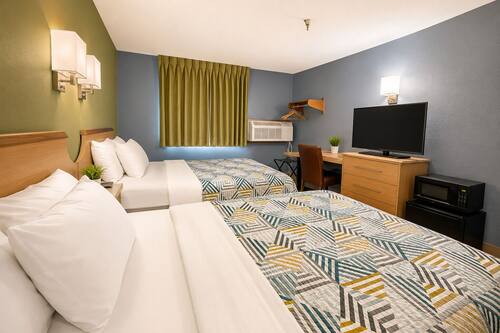 Desk, laptop workspace, free WiFi, bed sheets