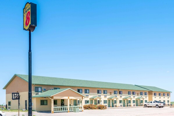 Guests can check in at the entrance, where a covered porch offers a sheltered space.