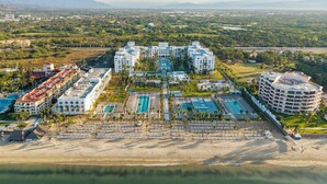 A resort with multiple buildings, a large pool area, and a beach. - Riu Flamingos - All Inclusive (Nuevo Nayarit)