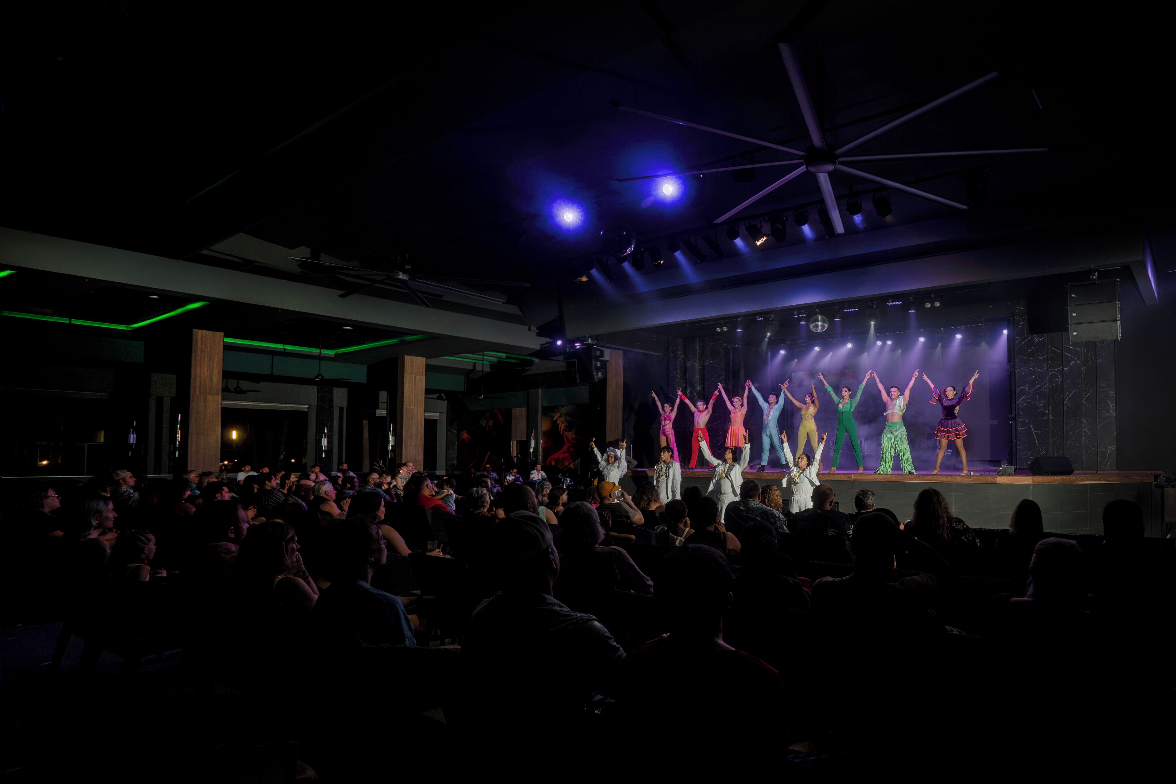 A theater with a stage and audience.