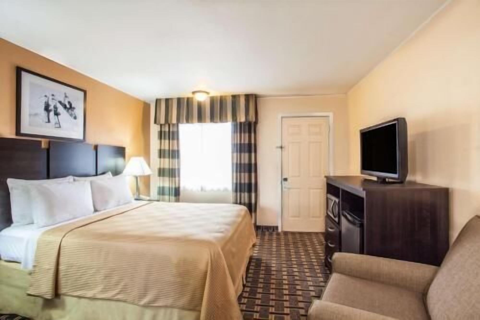 Desk, blackout drapes, iron/ironing board, rollaway beds