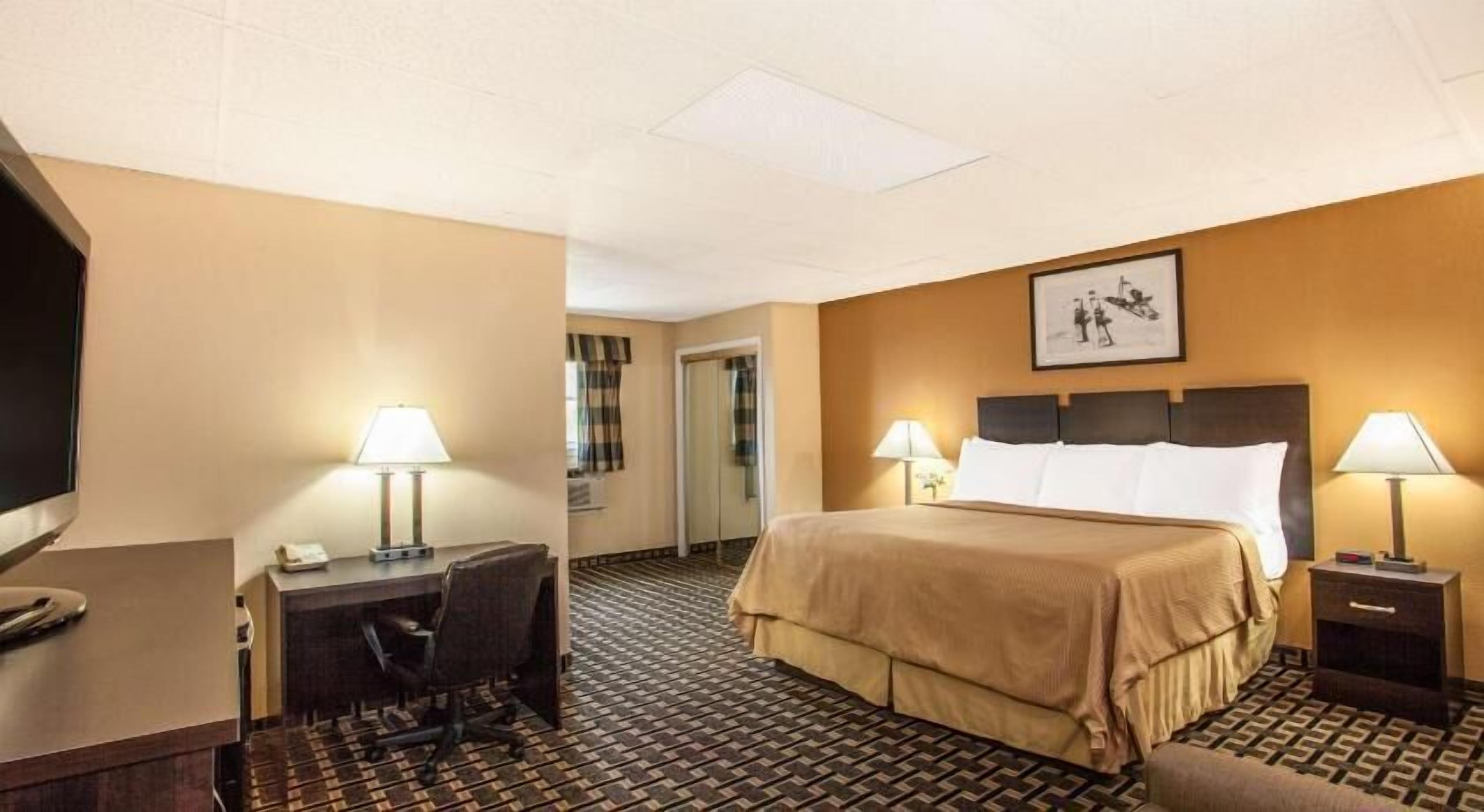 Desk, blackout drapes, iron/ironing board, rollaway beds