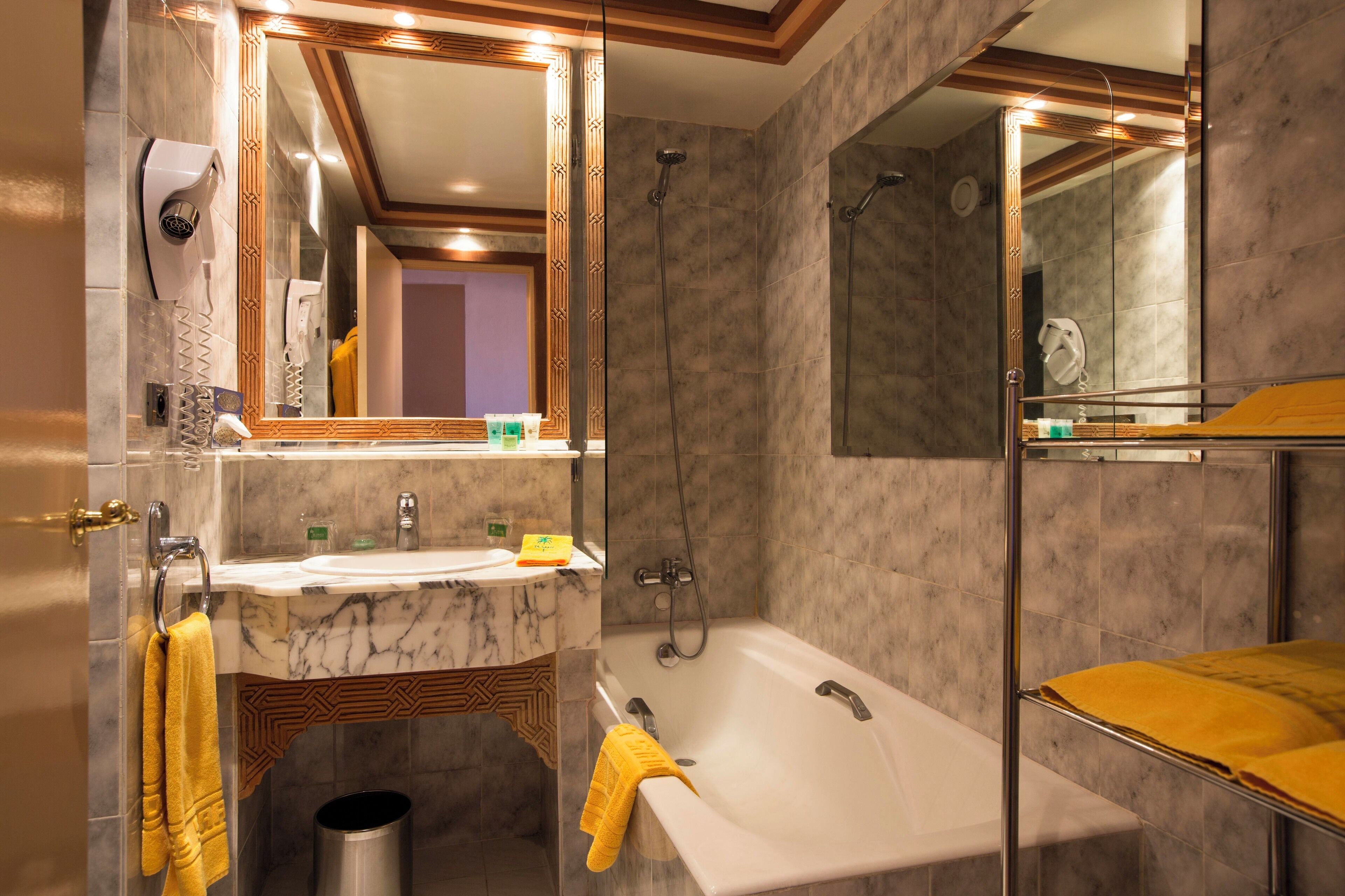 combined shower/bathtub, free toiletries, hair dryer, bathrobes