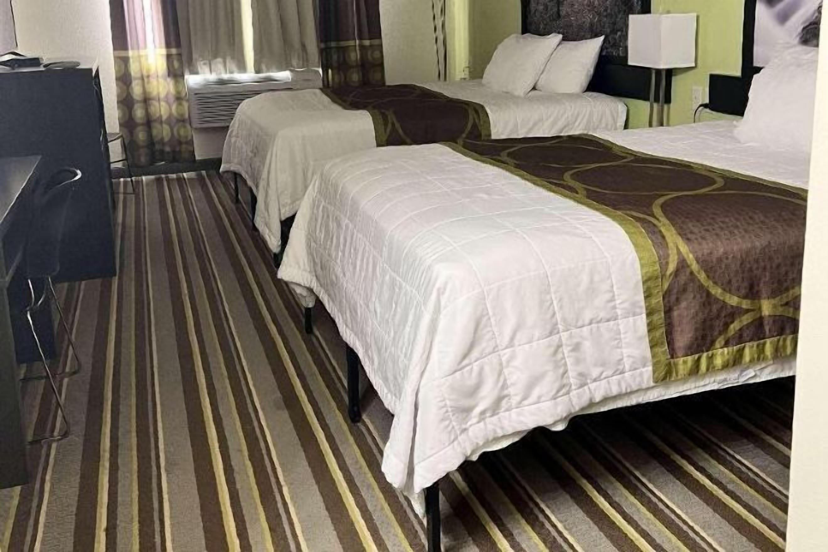 Premium bedding, desk, laptop workspace, soundproofing