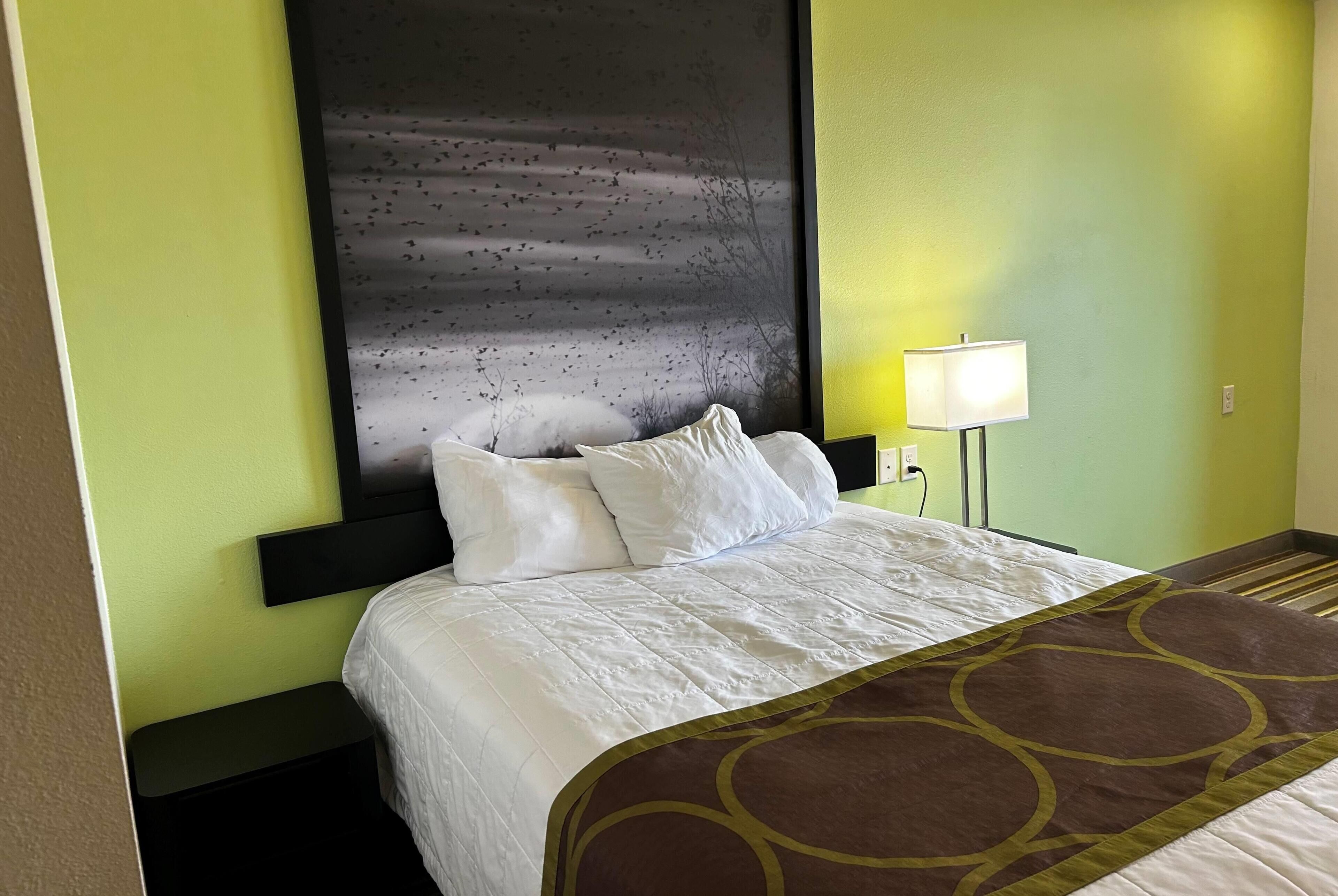 Premium bedding, desk, laptop workspace, soundproofing