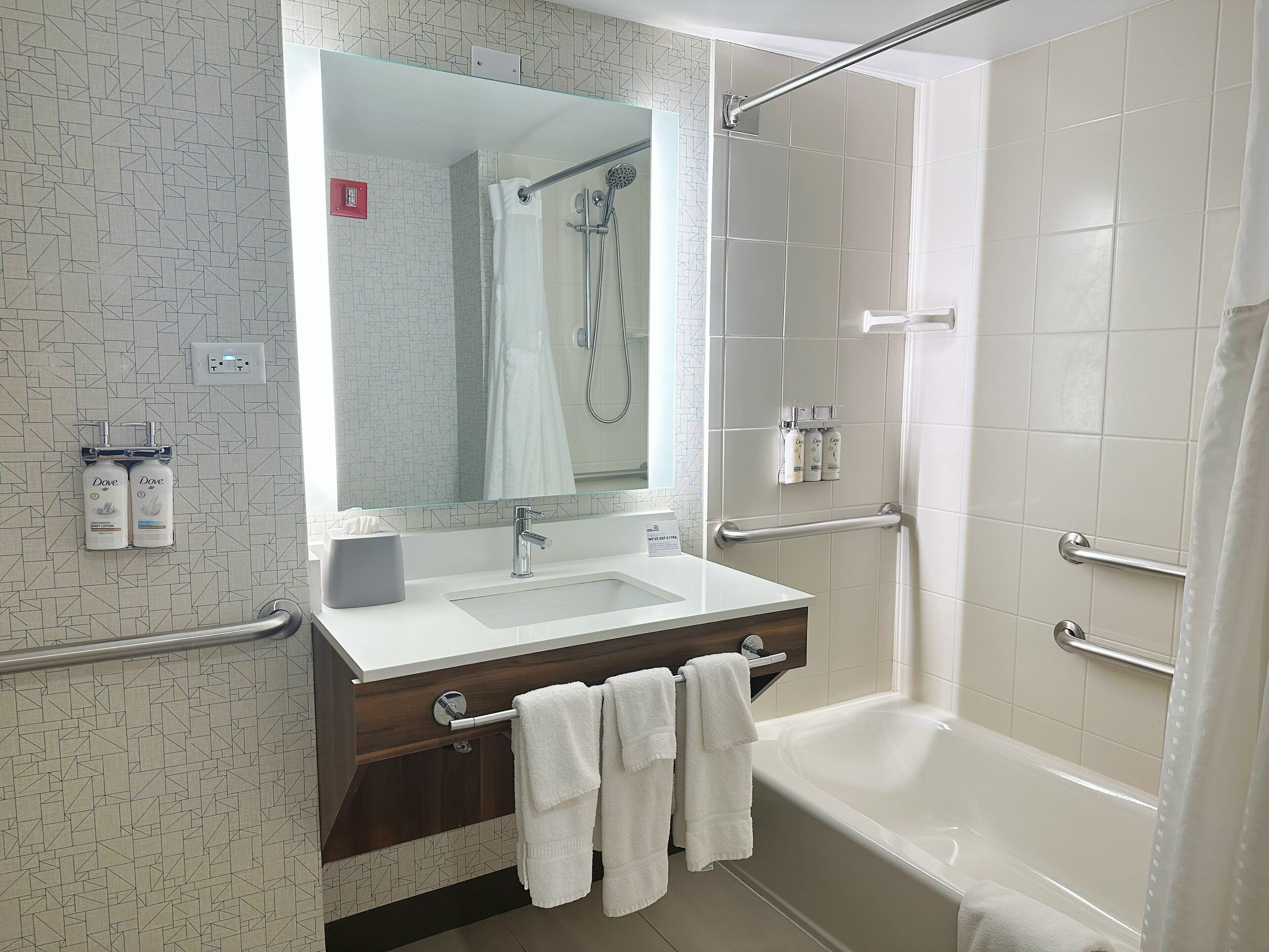 combined shower/bathtub, hair dryer, towels, soap