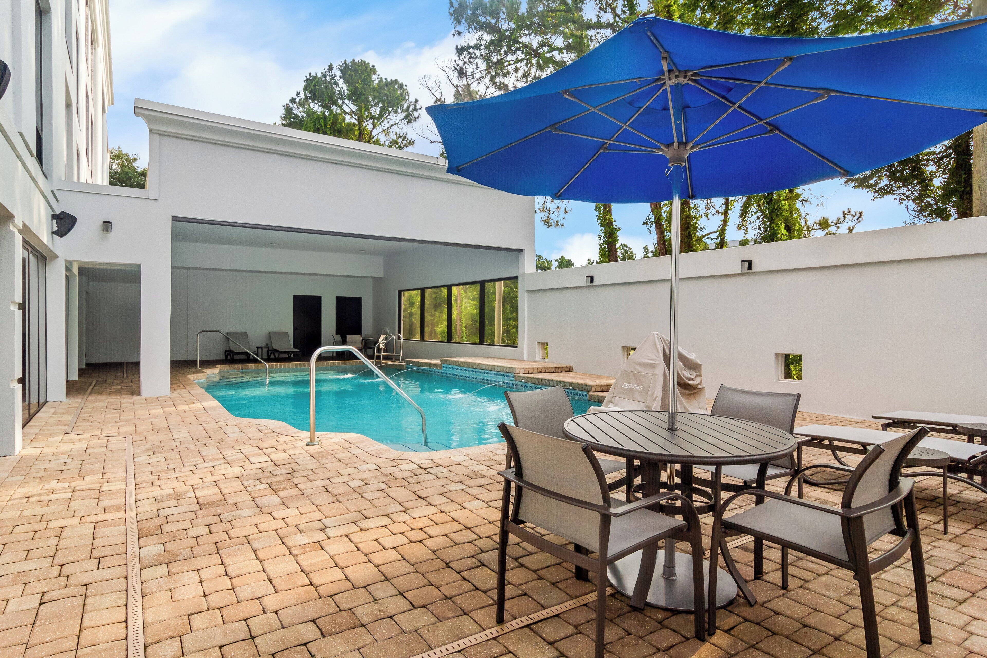 outdoor pool, open 8 am to 10 pm, pool umbrellas, pool loungers