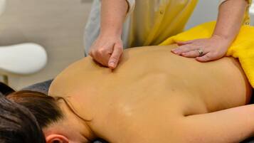 A person receiving a back massage.