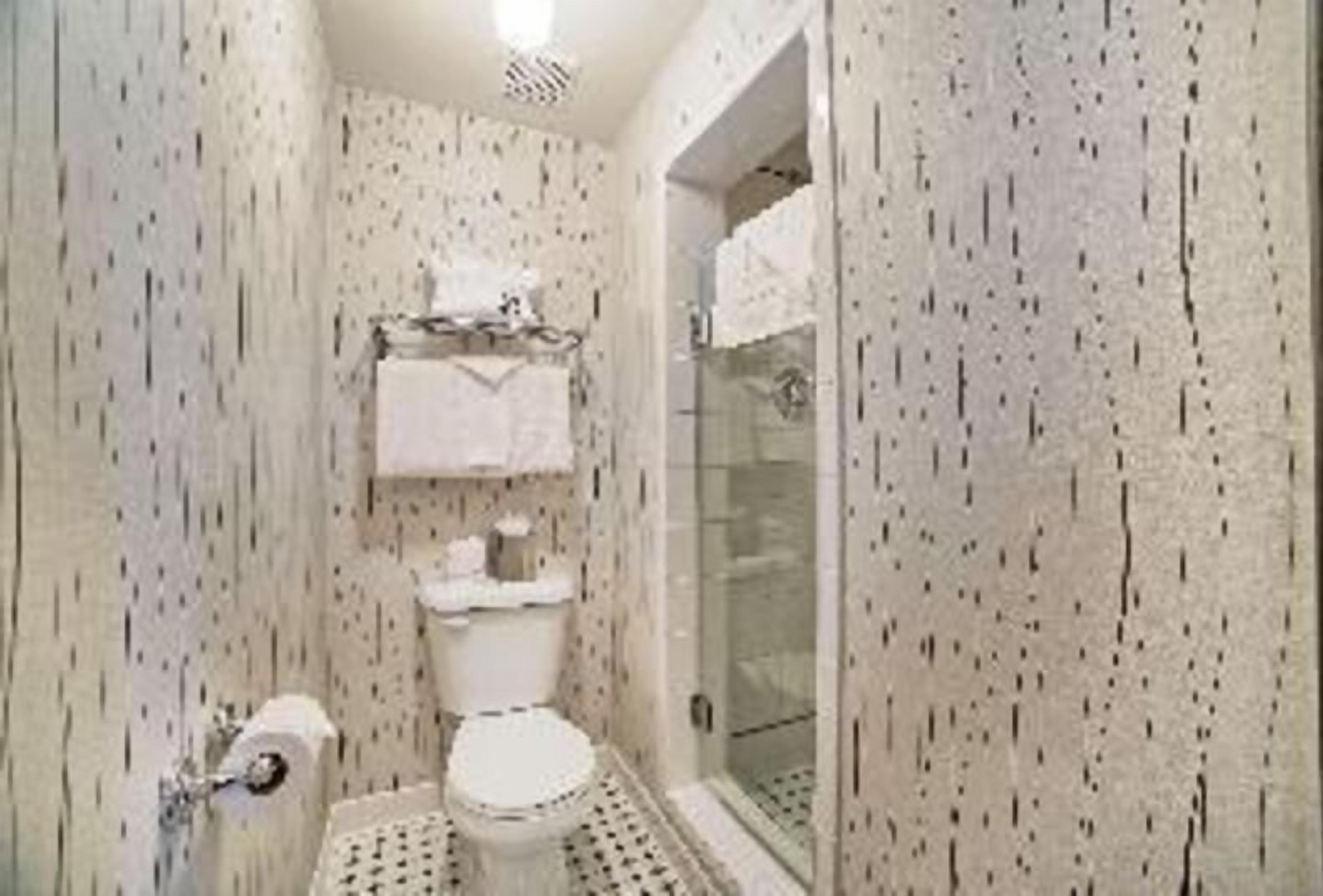 Combined shower/tub, designer toiletries, hair dryer, bathrobes