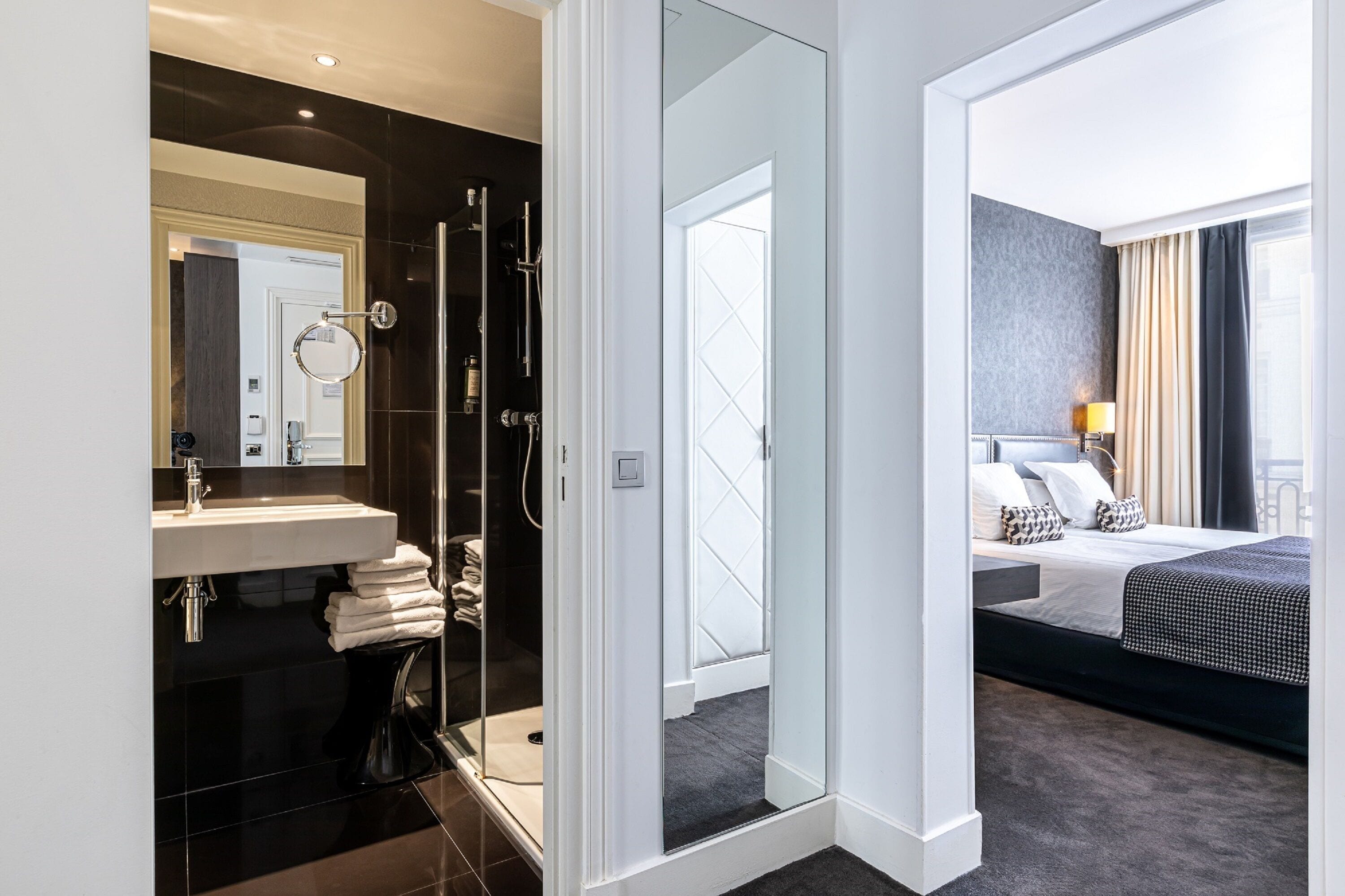 superior triple room | in-room safe, desk, laptop workspace, blackout curtains