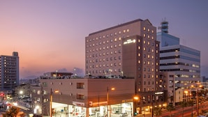 A multi-story hotel with a modern design, featuring a prominent 'Hotel City' sign. - Hotel JAL City Miyazaki (Miyazaki)