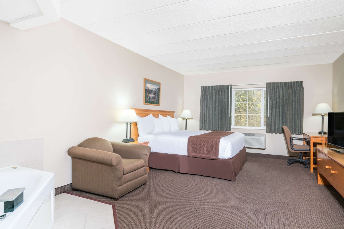 suite, 1 king bed, non smoking | desk, laptop workspace, blackout curtains, iron/ironing board