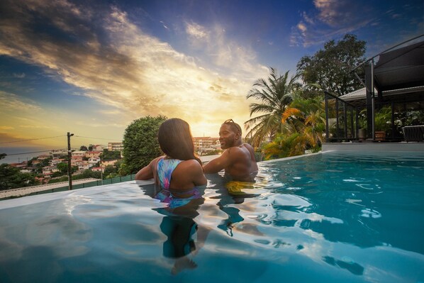 Outdoor pool, open 7:00 AM to 10:00 PM, pool umbrellas, pool loungers