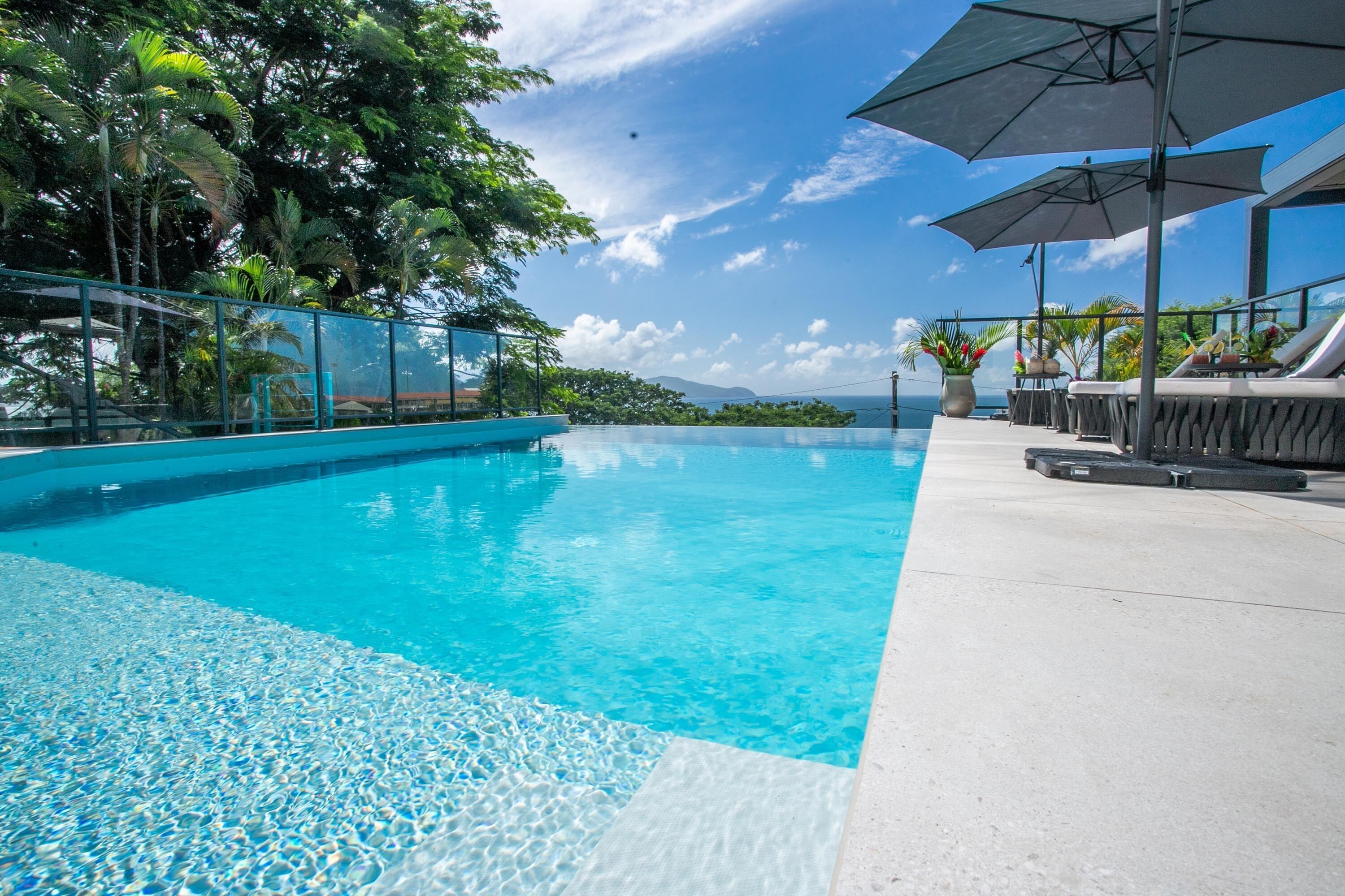 Outdoor pool, open 7:00 AM to 10:00 PM, pool umbrellas, pool loungers