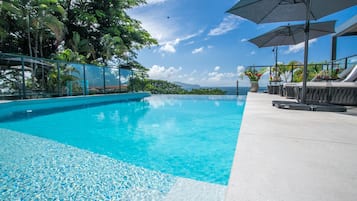 Outdoor pool, open 7:00 AM to 10:00 PM, pool umbrellas, pool loungers