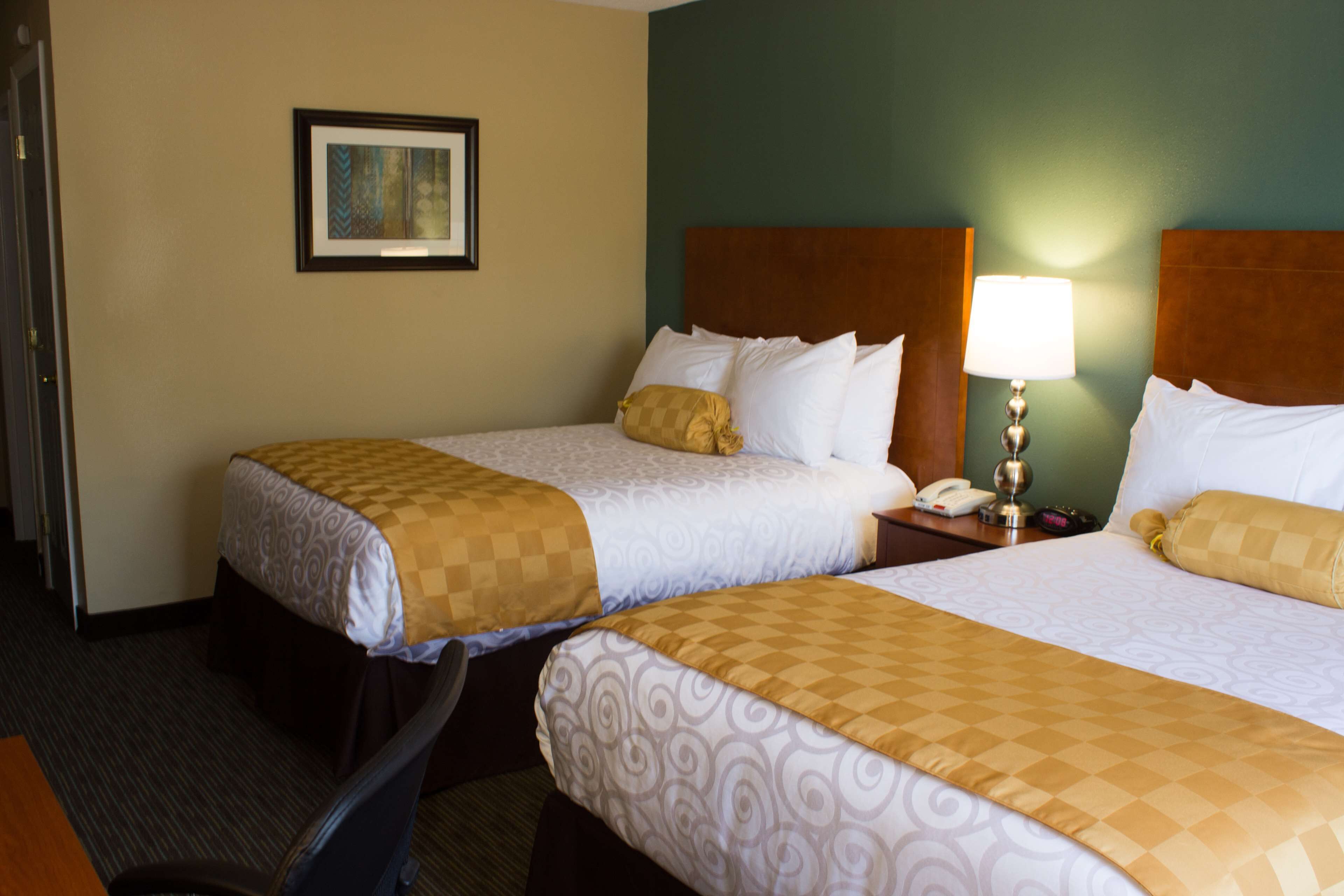 standard room, 2 double beds, non smoking, refrigerator & microwave | in-room safe, desk, iron/ironing board, cots/infant beds