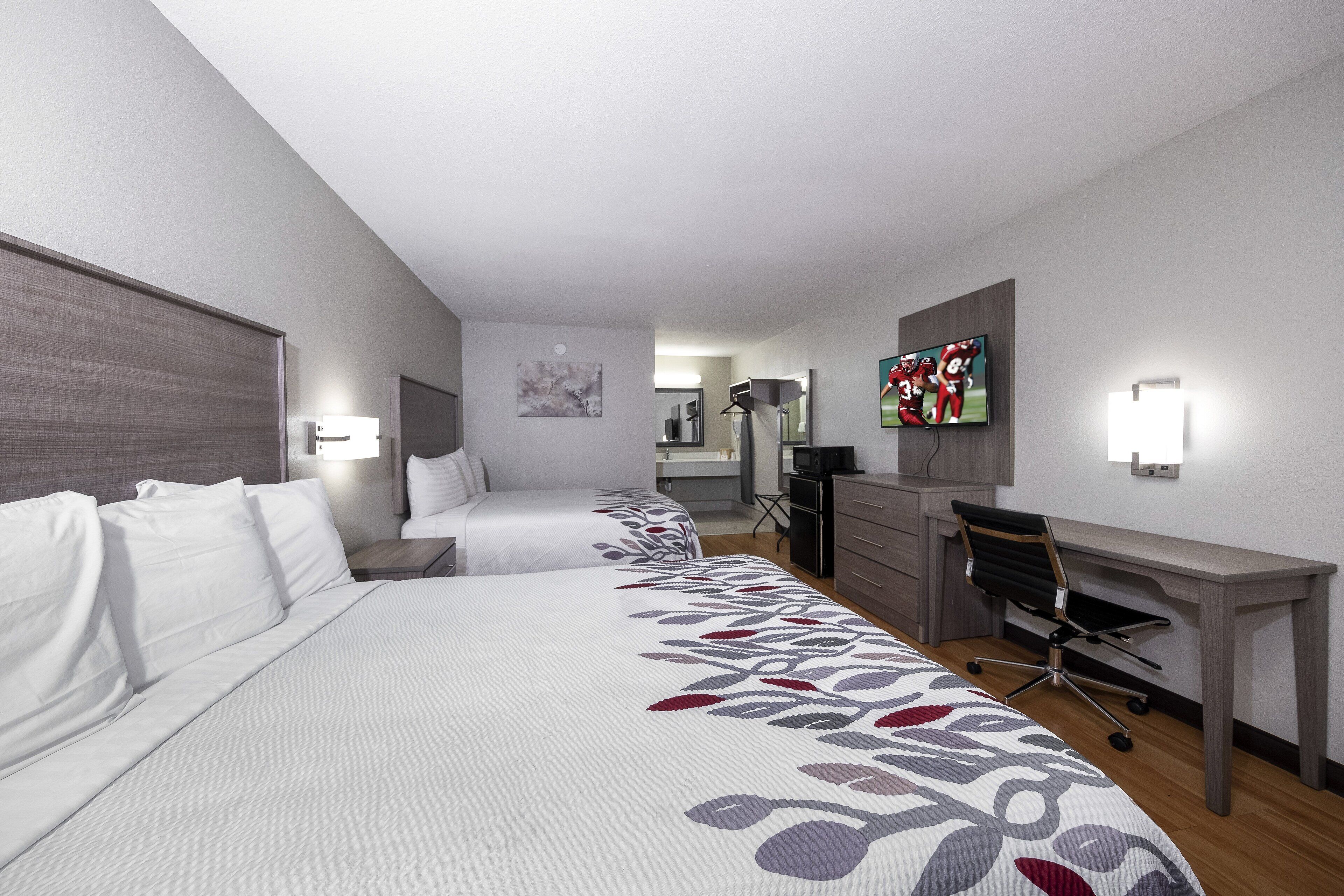 Deluxe Room, 2 Queen Beds, Non Smoking (Smoke Free) | Desk, laptop workspace, blackout drapes, iron/ironing board