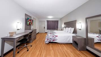 Desk, laptop workspace, blackout drapes, iron/ironing board