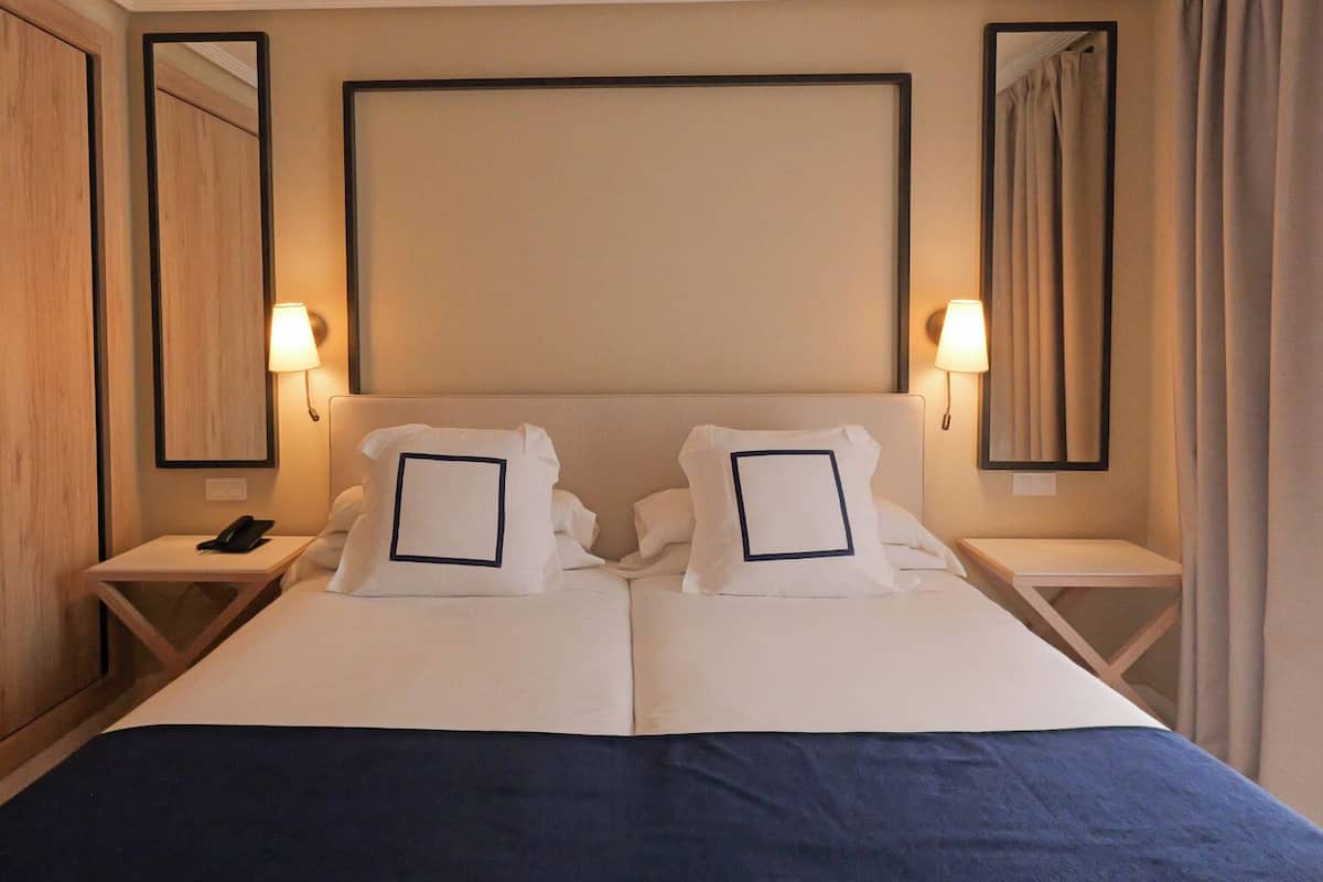 Down duvets, memory-foam beds, minibar, in-room safe